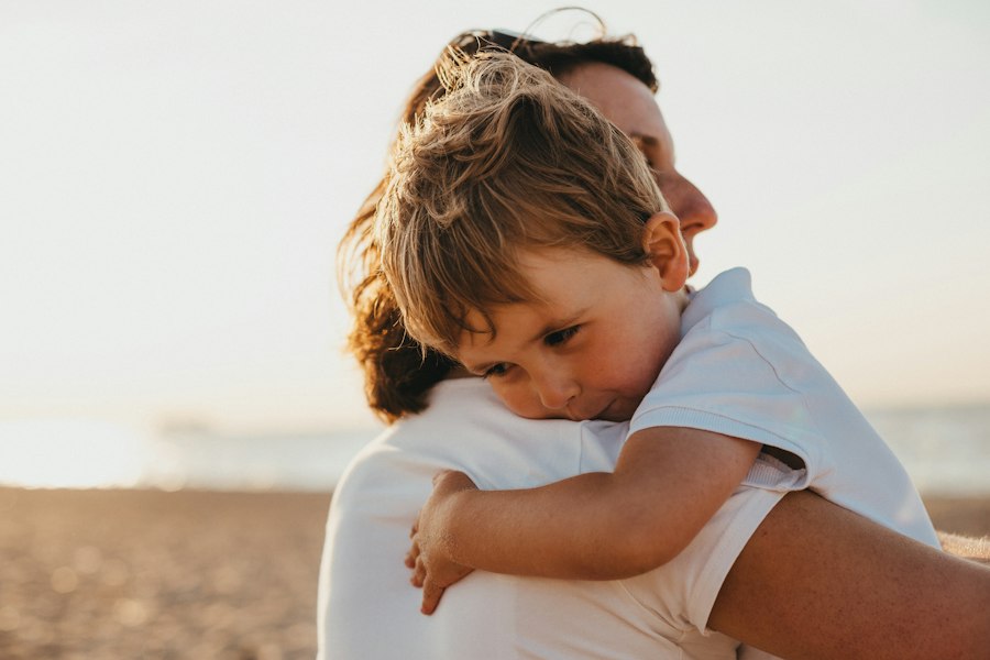A young boy hugging a parent